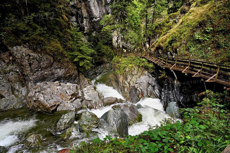 Wooden walkway on the Diosaz mountain river in the gorge, Gorges de la Diosaz, Les Houches, Chamonix-Mont-Blanc, Haute-Savoie, France