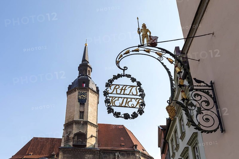 Ratskeller nose sign, in the background the tower of St. Wenzel City Church, Naumburg (Saale), Saxony-Anhalt, Germany