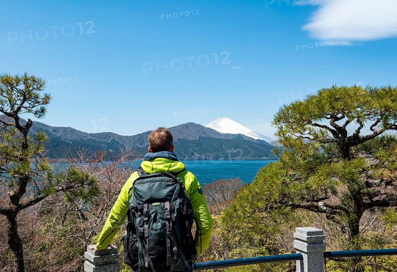 Tourist enjoying the view, Benten-no-hana Tenbodai viewpoint, Hakone Park, view of Lake Ashi with Mount Fuji volcano, Hakone, Japan