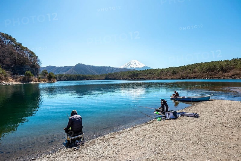 Anglers at Lake Saiko, behind volcano Mt. Fuji, Minamitsuru District, Yamanashi Prefecture, Japan