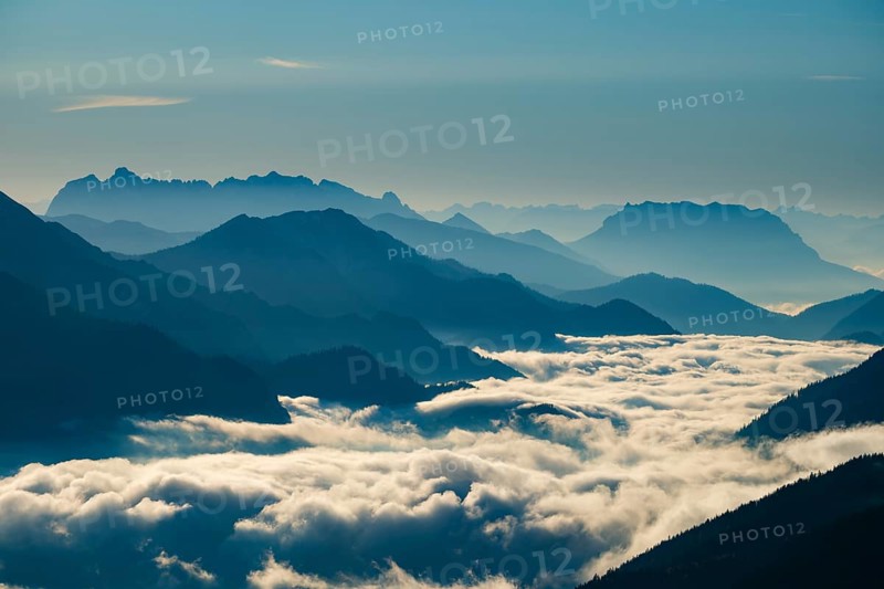 Blue-colored silhouette of mountains, fog in the valley, Wilder Kaiser and Chiemgau Alps, Upper Bavaria, Bavaria, Germany