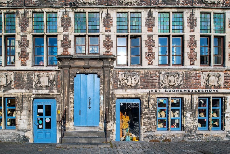 Façade of 17th century baroque guildhall Korenmetershuis at the Graslei in the city Ghent, East Flanders, Belgium