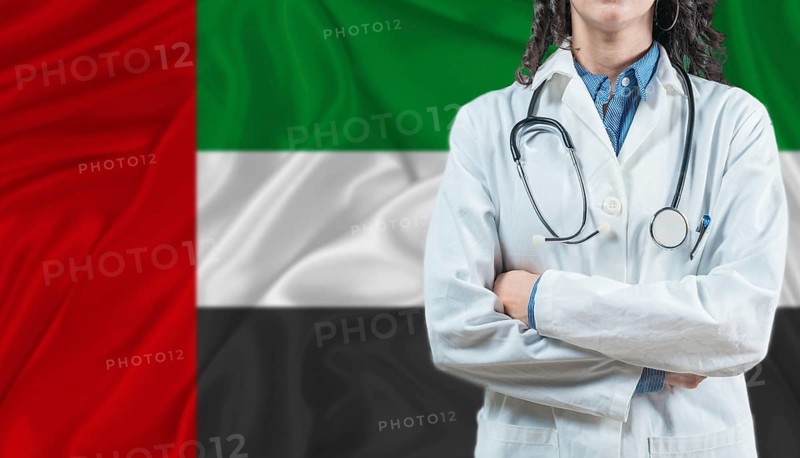 Medical professional on United Arab Emirates flag. Healthcare and wellness in United Arab Emirates, Concept