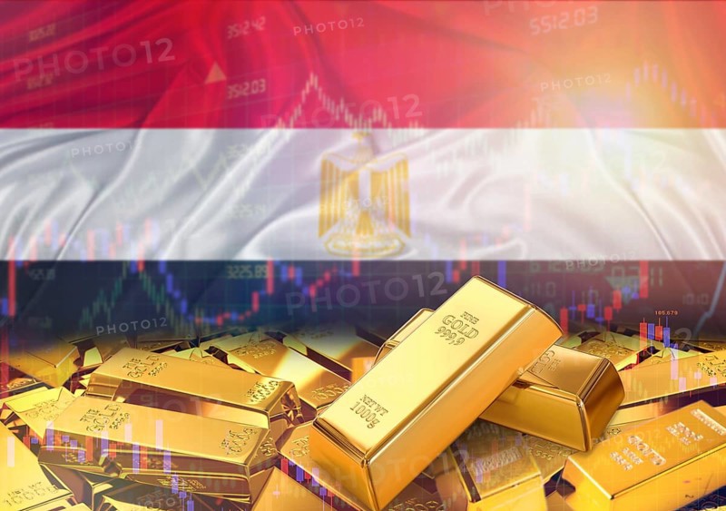 Gold bars on Egypt flag in background. Gold bars stacked on Egyptian flag. Concept of Egypt gold reserves