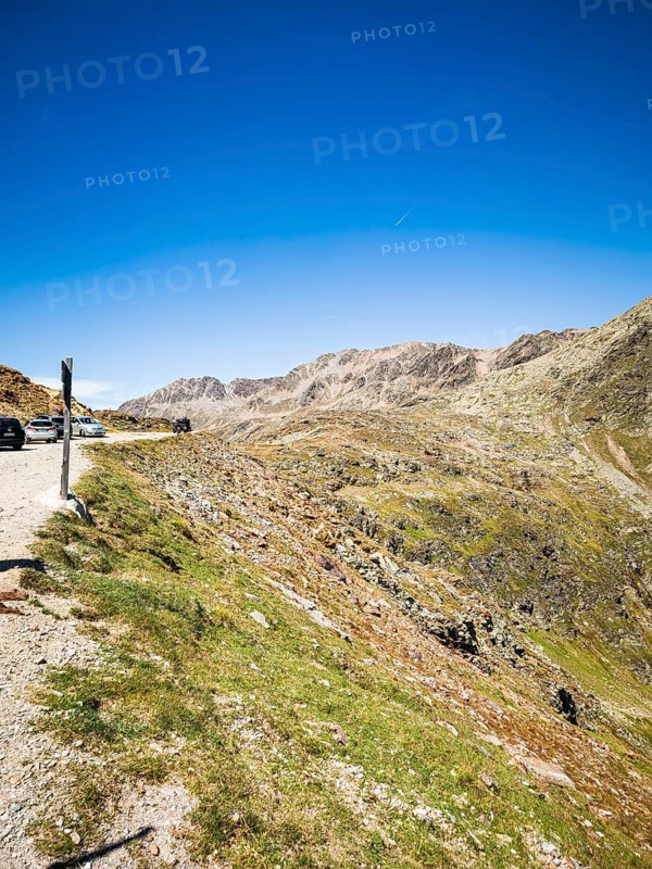 View of the high-alpine mountain landscape at the Timmelsjoch rest house on the border between Italy and Austria, above moss, South Tyrol, Italy, for editorial use only