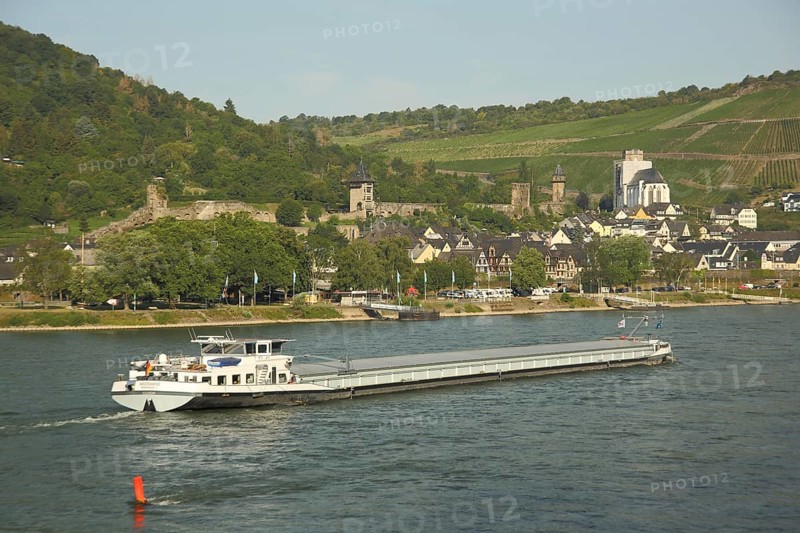 Cityscape with city fortifications and towers of Oberwesel on the Rhine with cargo ship, Rhineland-Palatinate, UNESCO, Upper Middle Rhine Valley, Germany