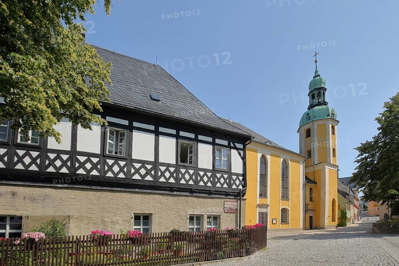 Half-timbered house and late baroque St. Bartholomew church, Wolkenstein, Ore Mountains, Saxony, Germany
