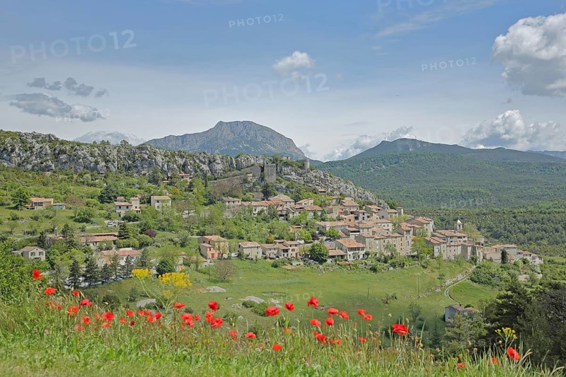 View of mountain village Trigance and landscape with mountains, poppies, Provençal Alps, Western Alps, Alps, Var, Provence, France