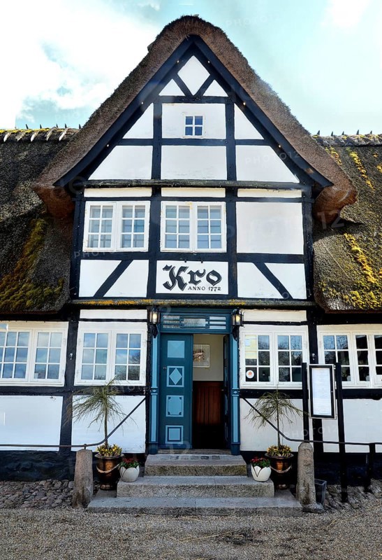 Danish inn, restaurant, in typical half-timbered house with thatched roof on Funen, Fyn island, Denmark, Scandinavia