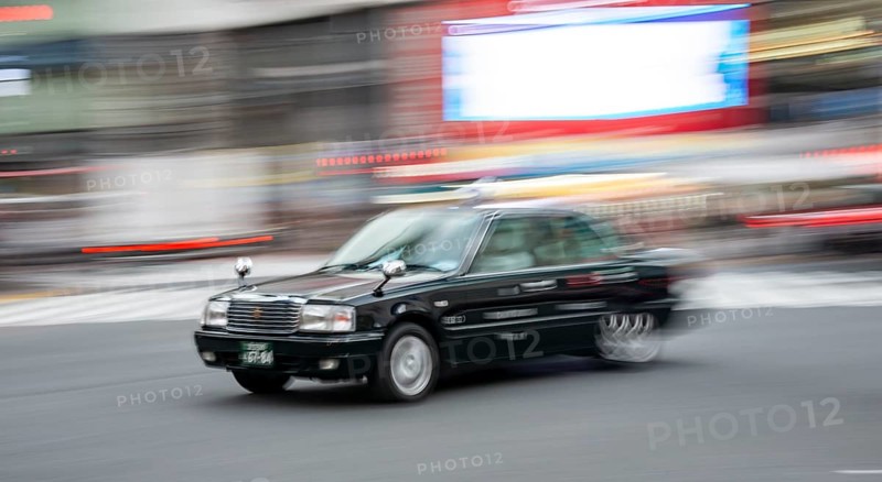 Black taxi driving, motion blur, long exposure, Shubuya Crossing, Shibuya, Tokyo, Japan