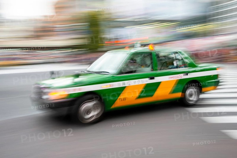 Green taxi driving, motion blur, long exposure, Shubuya Crossing, Shibuya, Tokyo, Japan