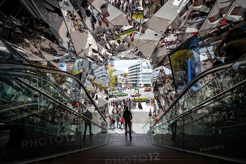 Young man on a stairway, entrance to a shopping center with many mirrors, Tokyu Plaza Omotesando Harajuku, modern architecture, Tokyo, Japan