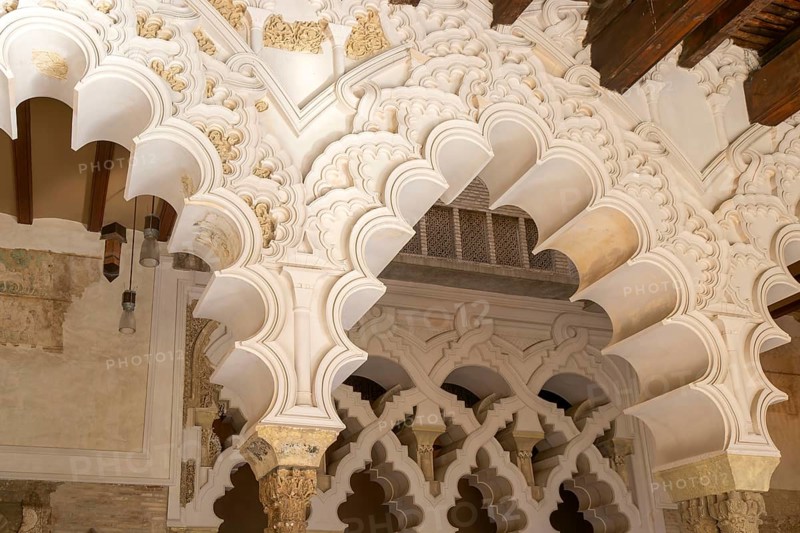 Ornate Islamic design of decorated Moorish arches, Aljafería Palace, Zaragoza, Aragon, Spain