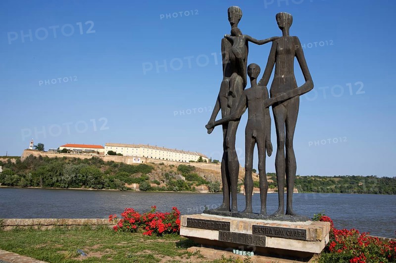 Memorial to the victims of the Novi Sad massacre, in the back the Petrovaradin Fortress or Petrovaradin on the Danube, Novi Sad, Vojvodina Province, Serbia