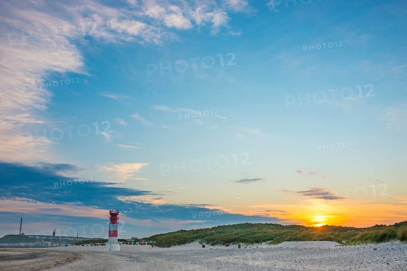 Red, white lighthouse Heligoland dune (Oberfeuer), striped, south beach, beach chairs, dunes, common beach oats (Ammophila arenaria (L.) Link, syn.: Calamagrostis arenaria (L.) Roth), wide sky, peaceful, in the background the main island, deserted, no one, warm, gentle sunlight at sunset, evening mood, relaxed atmosphere, atmospheric, colorful, quiet, vacation, summer, evening sun, Dune island, Heligoland, Pinneberg district, Schleswig-Holstein, North Sea, Germany