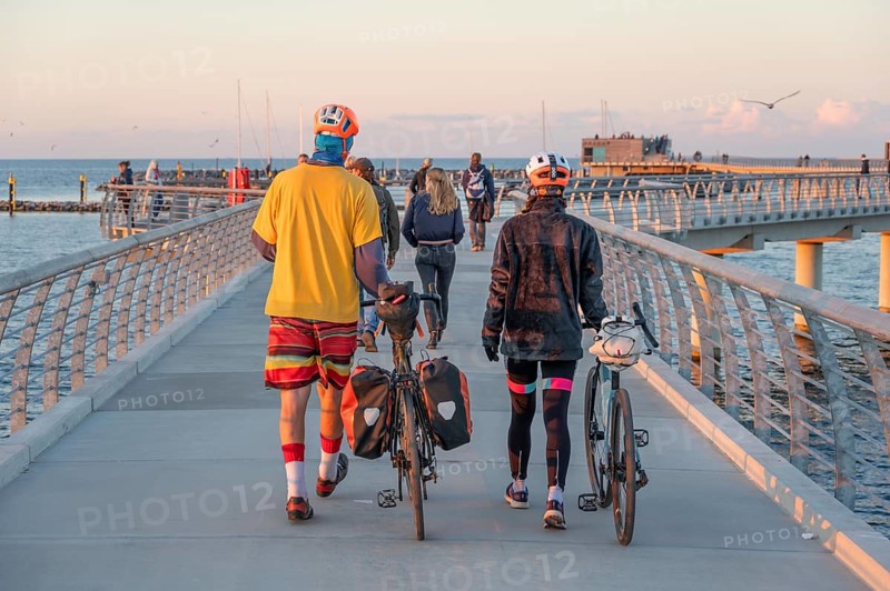 Tourists on the new 720-meter long pier in Prerow in the evening light, open since October 2024, Prerow, Darß, Mecklenburg-Western Pomerania, Germany