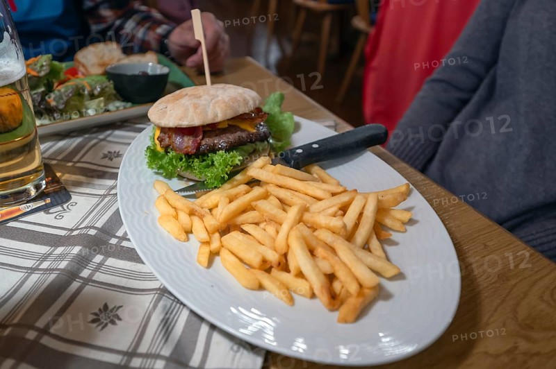 Burger, minced meat with grilled ham and French fries served in an inn, Franconia, Bavaria, Germany