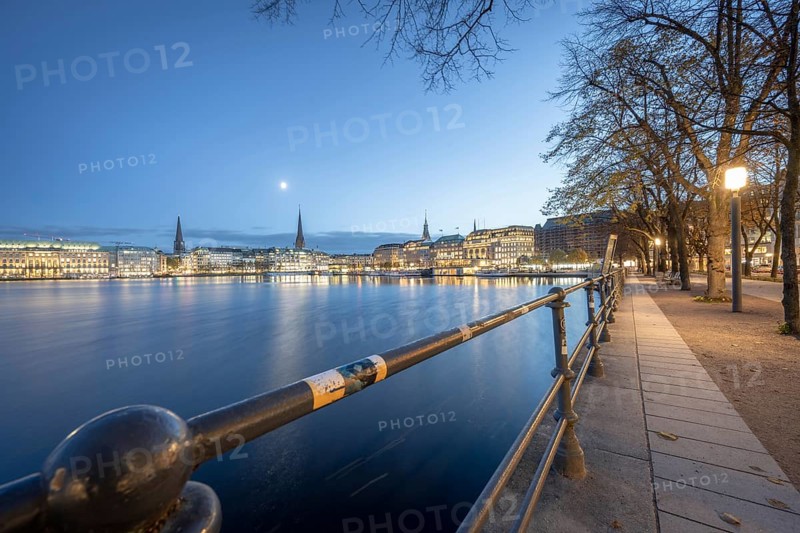 Inner Alster with footpath along Neuer Jungfernstieg at Blaue Stunde, Hamburg, Germany