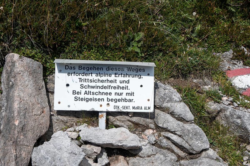 Warning sign with reference to alpine experience, sure-footedness, head for heights, old snow and crampons, on the way to Wasserfallscharte, Steinernes Meer, Berchtesgaden Alps, Austria