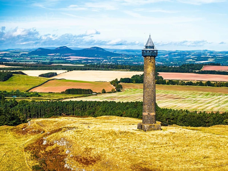 Waterloo Monument over Scottish fields and farms from a drone, Jedburgh, Scotland, UK