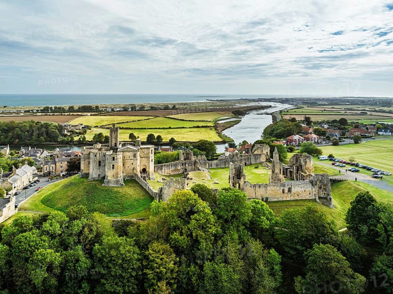 Warkworth Castle over River Coquet from a drone, Warkworth, Northumberland, England, United Kingdom