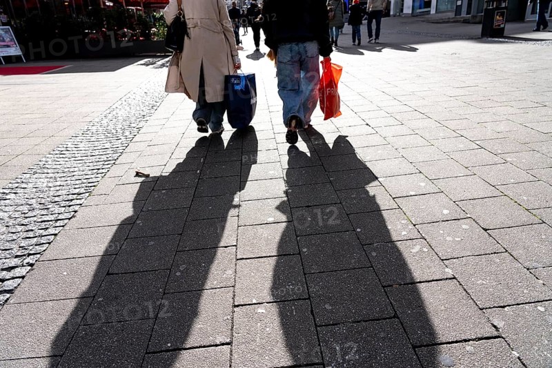 Shadows of passers-by shopping in the city center, Essen, North Rhine-Westphalia