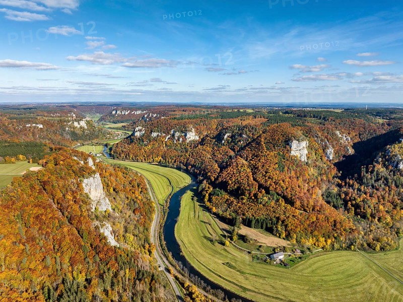 Aerial view of Upper Danube Valley surrounded by autumn vegetation, on the horizon Werenwag Castle, Sigmaringen district, Baden-Württemberg, Germany