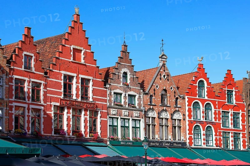 Historic houses on the market square in the old town of Bruges, Grote Markt, former guild houses, now restaurants and cafes, UNESCO World Heritage Site, Flanders, Belgium