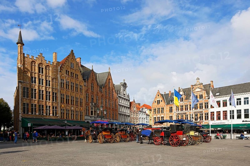 Historic houses on the market square in the old town of Bruges with horse-drawn carriages, Grote Markt, UNESCO World Heritage Site, Flanders, Belgium