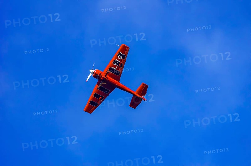 A Soviet Jakovlev Jak-55 sport aircraft with the registration LY-TOY during a flight demonstration as part of an air show on Rossfeld in Metzingen-Glems, Baden-Württemberg, Germany, for editorial use only