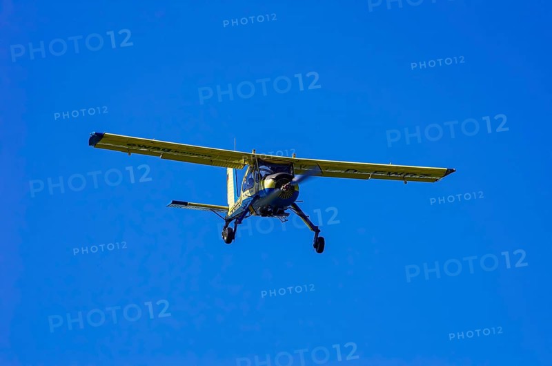 A PZL-104 Wilga-35A sport aircraft from Fliegerklub Kamenz with registration D-EWRZ during a flight demonstration as part of an air show on Rossfeld in Metzingen-Glems, Baden-Württemberg, Germany, for editorial use only
