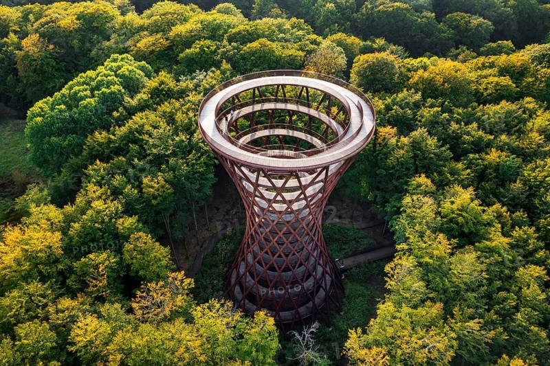 Aerial view over 45-meter-tall hyperboloid observation tower in forest near Gisselfeld monastery at Haslev on Zealand island in late summer, Denmark