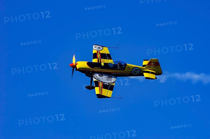A Votec 351 sport aircraft from the Swiss MSW Aviation AG with registration HB-YMV during a flight demonstration as part of an air show on Rossfeld in Metzingen-Glems, Baden-Württemberg, Germany, for editorial use only