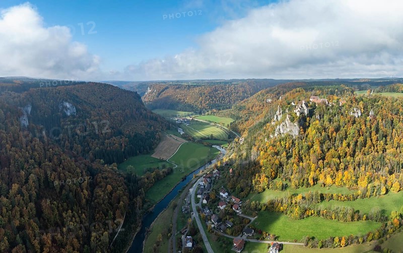 Aerial view, panorama of Werenwag castle and former castle on a rocky spur in the upper Danube Valley, surrounded by autumnal vegetation and clouds of fog, Sigmaringen district, Baden-Württemberg, Germany
