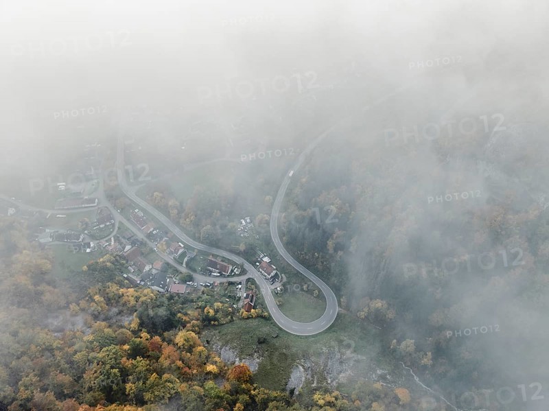 Aerial view of the viewpoint, shovels and Hausen Castle, also known as the Hausen ruins, surrounded by autumnal vegetation and clouds of fog on the village of Hausen in the valley in the Upper Danube Valley, Beuron, Sigmaringen district, Baden-Württemberg, Germany