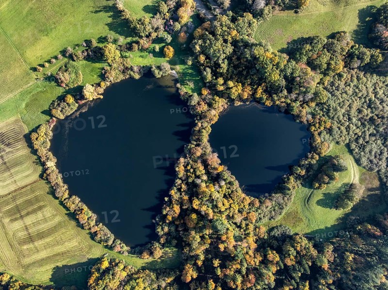 Aerial view of Lake Beech including Güttinger See, a swimming lake near Radolfzell am Lake Constance, on the horizon the Hegauberge Mountains, district of Constance, Baden-Württemberg, Germany