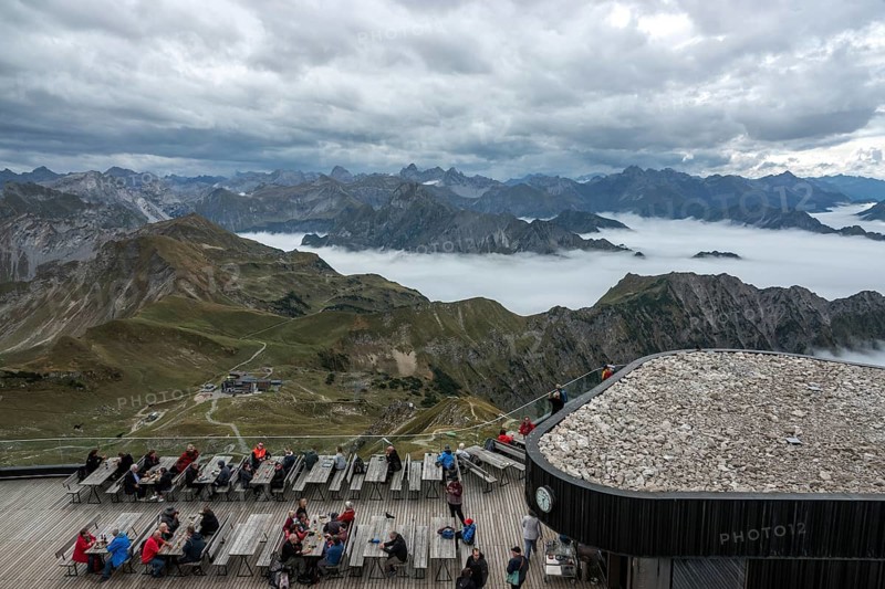 Restaurant at the Nebelhorn summit with views of the Allgäu Alps, mountains rising from fog in the valley, Oberstdorf, Oberallgäu, Allgäu, Bavaria, Germany