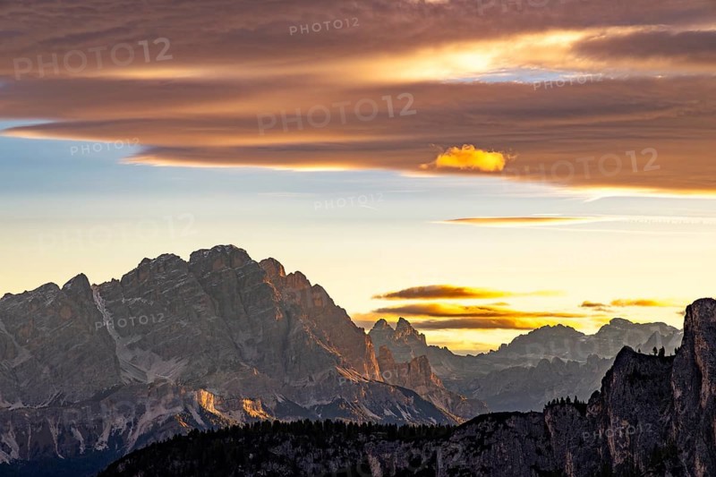 Sunrise over the Dolomites, coloured clouds above, Dolomites, Alps, Belluno province, Veneto region, Italy