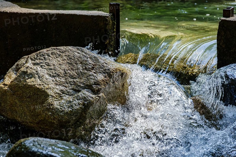 Water flows through an open dam, Horlachbach below the Stuiben Falls near Umhausen in Ötztal, Tyrol, Austria