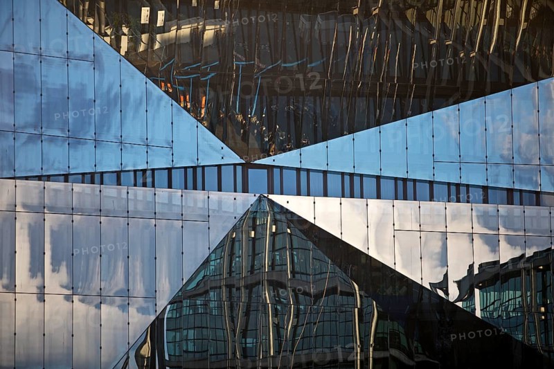 Cube Berlin, cube-shaped office building with folded glass façade reflecting the surroundings, detail, Washingtonplatz, Berlin, Germany