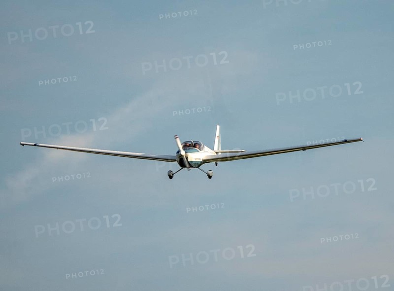 SF-25C Rotax Falke disc motor glider flying over Düsseldorf Airport, North Rhine-Westphalia, Germany