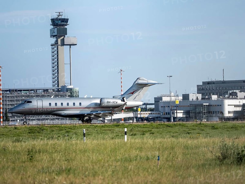Private jet of the type Bombardier Challenger 350, of the private airline VistaJet, during take-off at Düsseldorf Airport, North Rhine-Westphalia, Germany