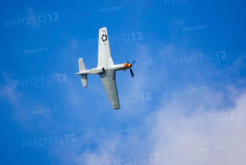 A North American P-51 Mustang of the flying group Flying Bulls, the Nooky Booky IV during an air show at the Rossfeld in Metzingen-Glems, Baden-Württemberg, Germany, for editorial use only