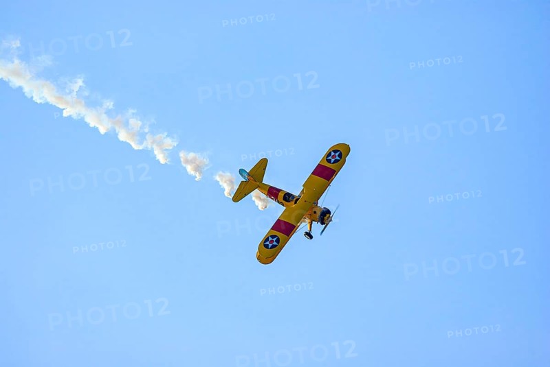 A Boeing-Stearman biplane during a flight demonstration as part of an air show at the Rossfeld in Metzingen-Glems, Baden-Württemberg, Germany, for editorial use only
