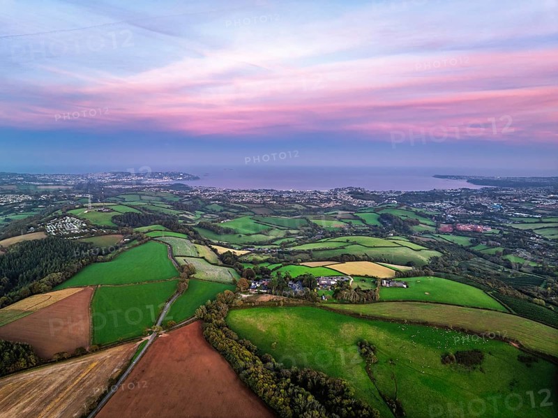 Twilight Sky of Torbay farms and fields from a drone, Totnes, Berry Pomeroy, Devon, England, United Kingdom