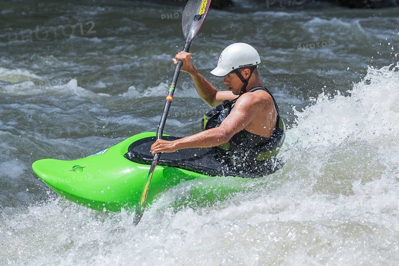 Young man kayaking in river, Costa Rica, Central America