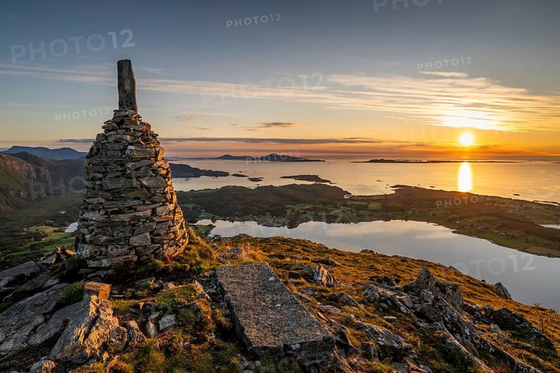 View of the Norwegian coast from the Rørsethornet stone steps, with 3292 steps one of the longest continuous stone steps in the world, Sherpat stairs or Midsund stairs or Midsundtrappene, Rørsethornet hike, cairns, sunset, Otroya or Otrøya island, Møre og Romsdal, Norway
