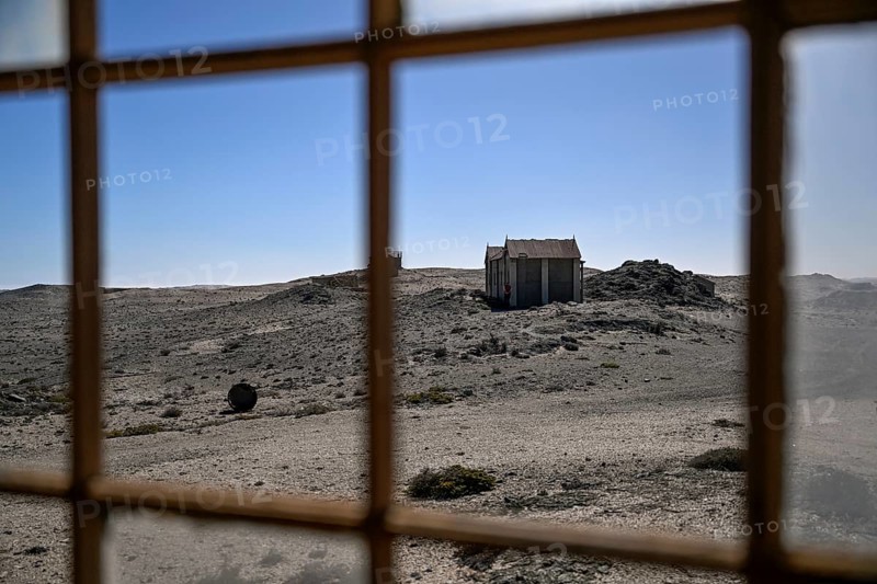 View from a dilapidated building into the desert, Pomona, restricted diamond area, near Lüderitz, Karas region, Namibia