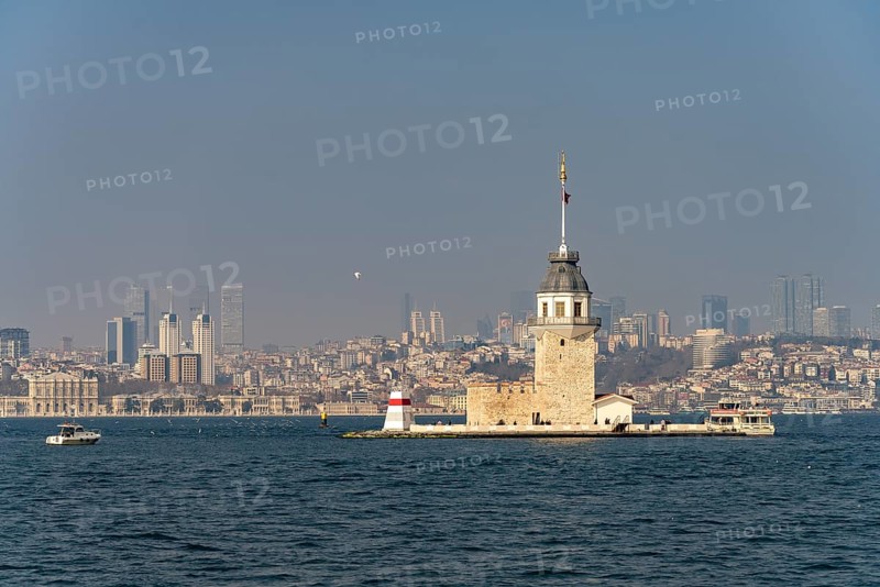 The Maiden Tower lighthouse, Leander Tower or Maiden Tower in front of the skyline of Istanbul, Turkey