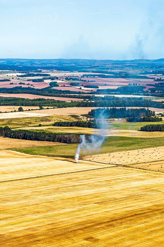 Scottish fields over Waterloo Monument from a drone, Jedburgh, Scotland, UK